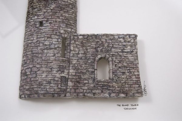 Photo of sculpture of Turlough round tower