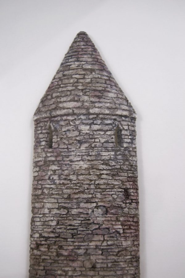 Photo of sculpture of Turlough round tower